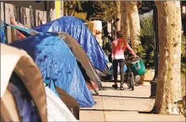  ?? Al Seib Los Angeles Times ?? BUSCAINO’S PROPOSAL would prohibit people from sleeping or camping on sidewalks and in other public spaces if they have turned down offers of shelter.