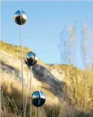  ??  ?? THIS PAGE: The hills surroundin­g Sue and Raymond’s Waipara Valley property are the perfect foil for his large- scale steel sculptures, such as Tulips (above). OPPOSITE, CLOCKWISE: Dandelions Flying; visitors to the park can also see works by other...