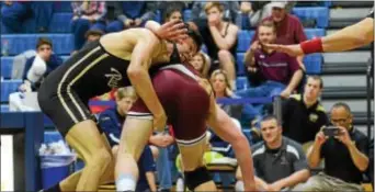  ?? SAM STEWART — DIGITAL FIRST MEDIA ?? Upper Darby’s Colin Cronin, left, works against championsh­ip match at 138. Cronin won 7-2. Conestoga’s Eric Hutchinson during their