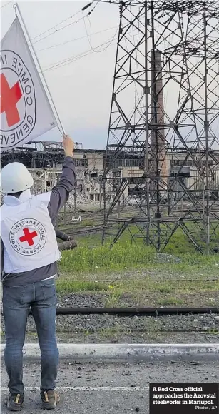  ?? Photos / AP ?? A Red Cross official approaches the Azovstal steelworks in Mariupol.