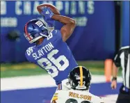  ?? Seth Wenig / Associated Press ?? Giants wide receiver Darius Slayton catches a pass for a touchdown against the Pittsburgh Steelers on Monday night.