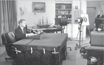  ?? WOA ?? PRESIDENT KENNEDY addresses the nation from the Oval Office at the height of the Cuban missile crisis in 1962. Back-channel talks between the White House and the Soviets were crucial in resolving the impasse.