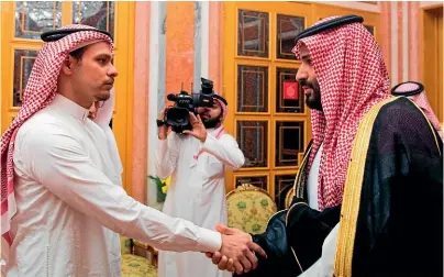  ?? AP ?? Saudi Crown Prince Mohammed bin Salman, right, shakes hands with Salah Khashoggi, a son, of Jamal Khashoggi, in Riyadh.