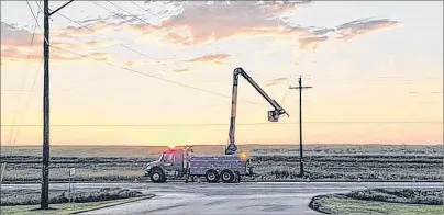  ?? SUBMITTED PHOTO ?? This photo taken by Maritime Electric linesman Todd MacInnis shows a crew from the utility working on the power lines in Mount Albion on Friday night. An intense combinatio­n of thunder and lightning caused more than 20,000 power outages.