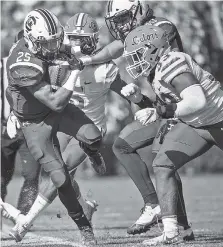  ?? THE ASSOCIATED PRESS ?? South Carolina’s A.J. Turner (25) runs by Florida linebacker David Reese (33) on Saturday in Columbia, S.C.