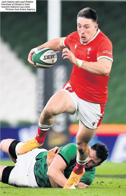  ??  ?? Josh Adams gets past Robbie Henshaw of Ireland in their Autumn Nations Cup clash.
Picture: Huw Evans Agency.