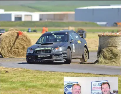  ?? 25_c28mach07 ?? Sinclair and MacLean’s matt black Subaru lifts a wheel as it pushed through a corner.