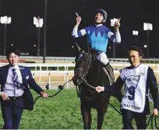  ?? Atiq ur Rehman/Gulf News ?? Vivlos, ridden by Joao Moreira, triumphed in the Dubai Turf, sponsored by DP World, at Meydan Racecourse yesterday.