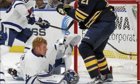  ?? JEFFREY T. BARNES — THE ASSOCIATED PRESS ?? Toronto Maple Leafs goalie Frederik Anderson (31) gets his mask knocked off during the first period of a preseason NHL hockey game against the Buffalo Sabres, Saturday Sept. 23, 2017, in Buffalo, N.Y.