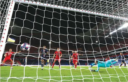  ??  ?? Bayern’s Kingsley Coman scores the winning goal during the Champions League final. Photo: AP