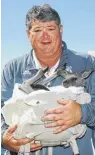  ?? Mark Kolbe / Getty Images ?? Rice coach David Bailiff poses with a kangaroo named “Archer” while in Australia this week.