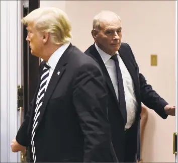  ?? Olivier Douliery / TNS ?? Chief of staff John Kelly, right, holds the door for President Donald Trump during an event on illegal immigratio­n and border security in the Roosevelt Room at the White House in Washington, D.C., on Nov. 1. Trump said Saturday that Kelly will leave his position at the end of the year.