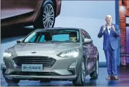  ?? PROVIDED TO CHINA DAILY ?? Nigel Harris, president of Changan Ford, introduces the all-new Focus in Chongqing on April 10.