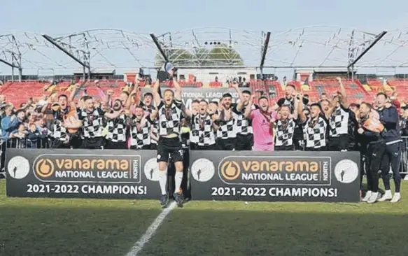  ?? ?? Gateshead captain Greg Olley lifts the National League North League title. Photo by Charles Waugh.