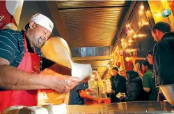  ?? ROSS GIBLIN/STUFF ?? Rajah Vellasamy preparing his famous roti for Wellington on a Plate in 2011.