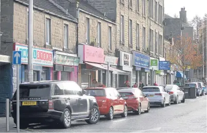  ??  ?? A correspond­ent notes that while the West End worries about branding, Lochee is neglected to the point that its High Street, pictured, can’t sustain two chemist shops.