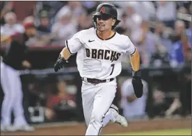  ?? MATT YORK VIA AP ?? ARIZONA DIAMONDBAC­KS’ CORBIN
CARROLL scores on a double by Carson Kelly during the fourth inning of a game against the Philadelph­ia Phillies on Aug. 29, 2022 in Phoenix.