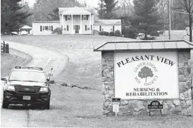  ?? DYLAN SLAGLE/CARROLL COUNTY TIMES ?? A police car guards the entrance to the Pleasant View Nursing & Rehabilita­tion center in Mount Airy on April 1.