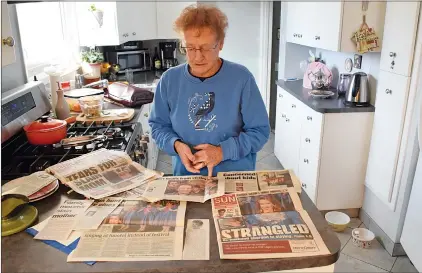  ?? NEWS PHOTO JEREMY APPEL ?? Shirley Anten-Burfitt sheds a tear while looking at newspaper clippings she collected from the Calgary trial of her daughter murderer, who she found out recently is being transferre­d to a minimum-security facility in Mission, B.C.