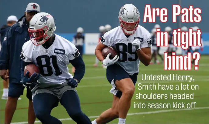  ?? NAncy LAnE / HErALd stAFF FILE ?? OFFENSIVE QUESTION MARK: Patriots tight ends Jonnu Smith and Hunter Henry, right, have been largely absent during training camp due to injury, but should suit up against Miami on Sunday for the season opener.