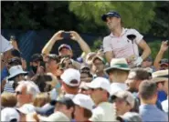  ?? CHARLIE RIEDEL — THE ASSOCIATED PRESS ?? Justin Thomas watches his tee shot on the 15th hole during a practice round for the PGA Championsh­ip golf tournament at Bellerive Country Club, Wednesday in St. Louis.
