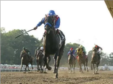  ?? THE ASSOCIATED PRESS ?? Bayern, with Martin Garcia riding, wins the $1 million Haskell Invitation­al horse race at Monmouth Park on July 27in Oceanport, N.J. Monmouth Park Racetrack is hoping sports gambling will save itself from the slow extinction facing much of the horse...