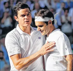  ?? AP PHOTO ?? Roger Federer, right, greets Milos Raonic at the net after winning their Men’s Singles Quarterfin­al Match on day nine at the Wimbledon Tennis Championsh­ips in London on Wednesday.