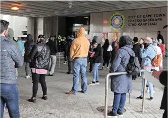  ?? TRACEY ADAMS African News Agency (ANA) ?? QUEUES of frustrated Capetonian­s, mostly wanting to renew car licences, at the Cape Town Civic Centre. Capetonian­s queued for hours in the cold without any news as to how much longer they would have to wait. |