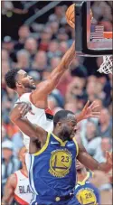  ?? AP-Craig Mitchelldy­er ?? Trail Blazers forward Maurice Harkless, top, shoots over Warriors forward Draymond Green during the first half of Game 3 of the playoffs finals in Portland, Ore., on Saturday.