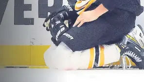  ?? GETTY imAgES fiLE ?? DOWN AND OUT: Bruins defenseman Brandon Carlo pauses on the ice after a third-period injury against the New York Islanders in Game 3 of their second-round playoff series on June 3.