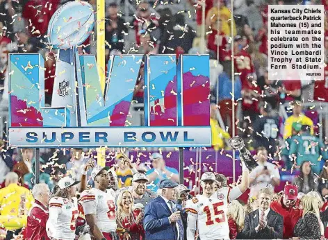  ?? REUTERS ?? Kansas City Chiefs quarterbac­k Patrick Mahomes (15) and his teammates celebrate on the podium with the Vince Lombardi Trophy at State Farm Stadium.