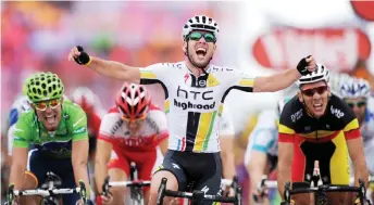  ?? — AFP photo ?? File photo shows Cavendish celebrates on the finish line as he wins the fifth stage of the 2011 Tour de France cycling race run between Carhaix and Cap Frehel, western France.