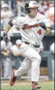  ?? NATI HARNIK / AP ?? Oregon State’s Steven Kwan runs to first after hitting an RBI single Saturday.