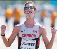  ?? CP PHOTO ?? Canada’s Evan Dunfee reacts as he crosses the finish to win the men’s 20km race walk at the Pan Am Games in Toronto, Ont., Sunday.