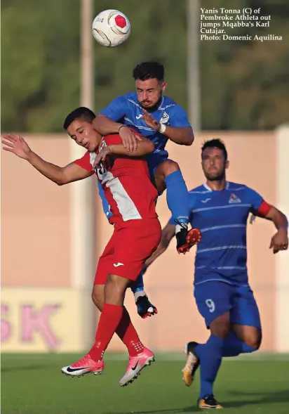  ??  ?? Yanis Tonna (C) of Pembroke Athleta out jumps Mqabba's Karl Cutajar. Photo: Domenic Aquilina