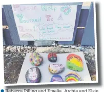  ??  ?? ●● Rebecca Pilling and Emelia, Archie and Elsie are giving away hand colourfull­y decorated rocks with uplifting slogans