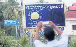  ??  ?? SIGN OF THE TIMES: A sign placed by the Cambodia National Rescue Party, which has been subject to a crackdown by Hun Sen’s ruling government.