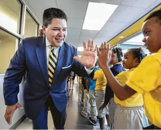  ?? Steve Gonzales / Staff file photo ?? Then-HISD Superinten­dent Richard Carranza greets students in 2017 at Codwell Elementary. Carranza spent about 18 months in HISD before quitting to lead New York City public schools.