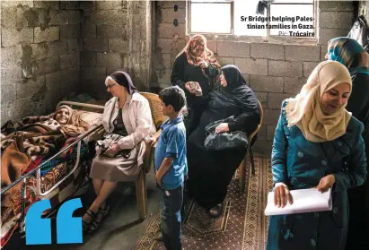  ?? Pic: ?? Sr Bridget helping Palestinia­n families in Gaza. Trócaire