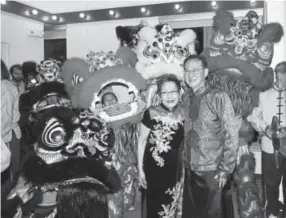  ?? Photos by Pam Cress, Special to The Denver Post ?? Linda and Jimmy Yip, who establishe­d the Nathan Yip Foundation as a living memorial to their son, among the Lion Dancers that performed at the Chinese New Year Gala.