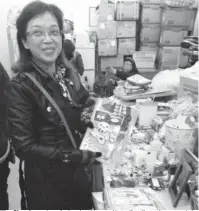  ?? PROVIDED TO CHINA DAILY ?? Woo Chun-hung shops for her daughters and herself on the exchange market. She always wears her favorite leather jacket.
