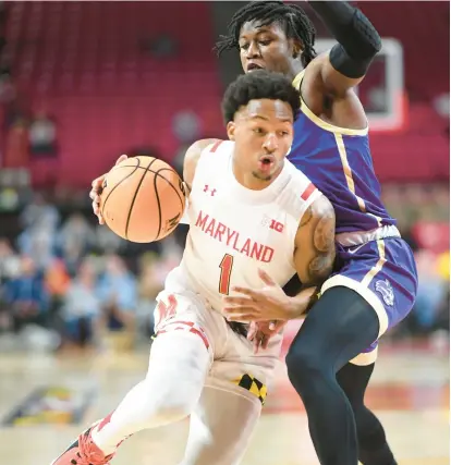  ?? JONATHAN NEWTON/THE WASHINGTON POST ?? Maryland guard Jahmir Young drives against Western Carolina guard DJ Campbell during Thursday night’s game at Xfinity Center. Young scored 16 points on 6-for-15 shooting against the Catamounts.