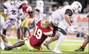  ?? Steven Eckhoff / Rome News-Tribune ?? Rome defensive end Adam Anderson (19) tackles Kell quarterbac­k Evan Conley during Friday’s Region 7-5A game at Barron Stadium.