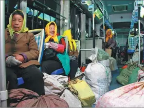  ?? PROVIDED TO CHINA DAILY ?? Farmers transport their goods by electric bus in Qingdao, Shandong province.