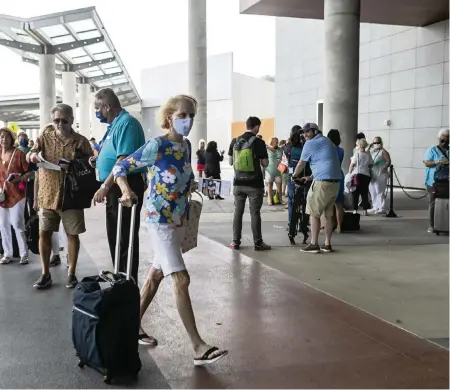  ?? MATIAS J. OCNER mocner@miamiheral­d.com ?? Robbyn Wilson arrives at Port Everglades Terminal 25 in Fort Lauderdale before boarding Celebrity Cruises’ Celebrity Edge cruise ship on June 26.