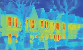  ?? Photograph: Cultura RM/Alamy ?? Thermal image of houses on a city street.