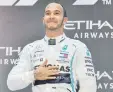  ??  ?? Lewis Hamilton celebrates a victory in Abu Dhabi, UAE, Dec. 1, 2019.