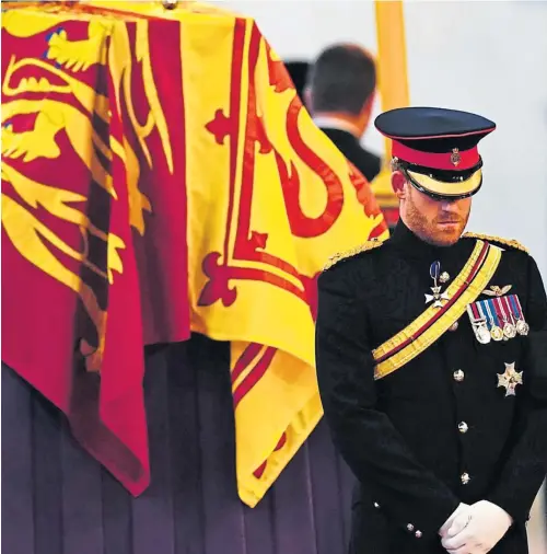  ?? ?? The Duke of Sussex joins his brother and cousins as they mount a vigil beside the Queen’s coffin last night