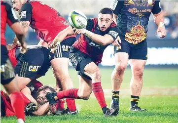  ?? — AFP photo ?? Canterbury Crusaders’ Richie Mo’unga makes a pass during their Super Rugby semi-final match between the Canterbury Crusaders and Waikato Chiefs at AMI Stadium in Christchur­ch on July 29, 2017.
