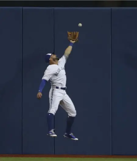  ?? RICHARD LAUTENS/TORONTO STAR ?? Jays centre fielder Kevin Pillar can’t quite catch up to this Travis Shaw first-inning triple. Milwaukee scored four runs off J.A. Happ in four-plus innings, then hung on to beat the Jays 4-3 to drop Toronto’s record to 1-6.